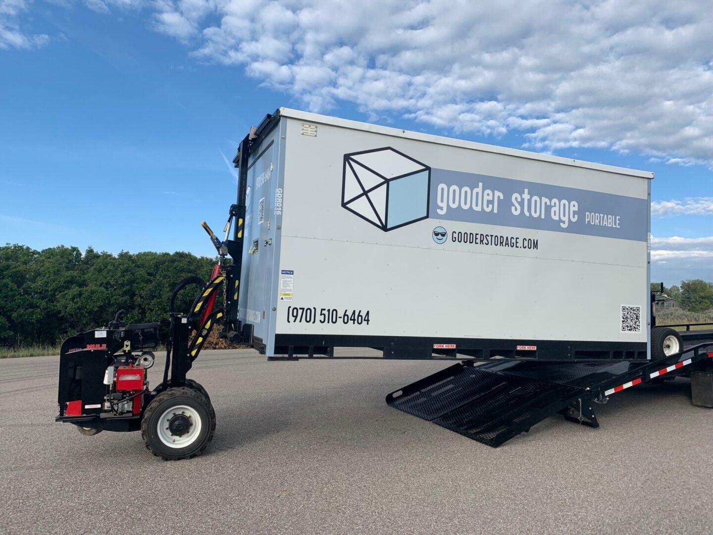 A large truck with a trailer attached to it