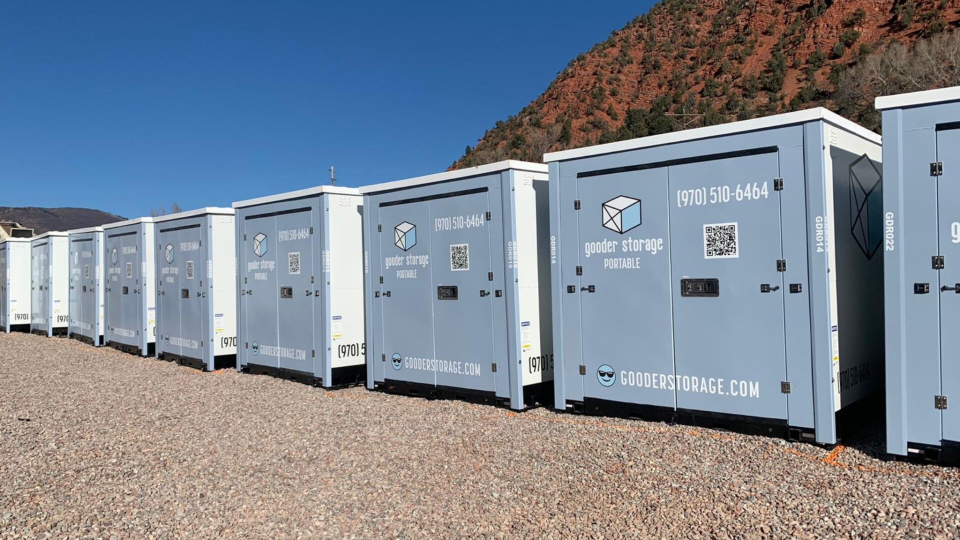 A row of blue and white storage containers.