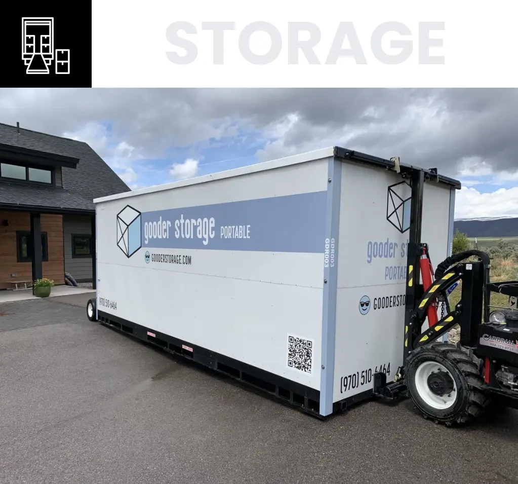 A large white storage container on the back of a truck.