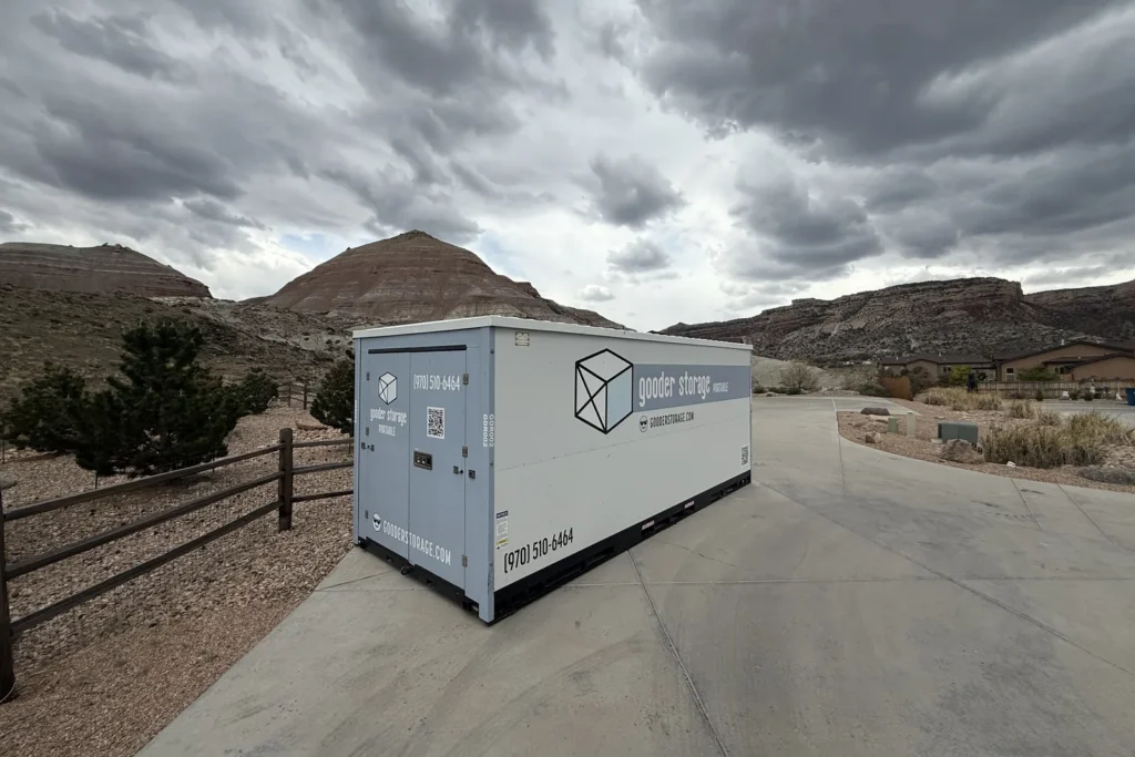 Gooder mobile storage box on a Grand Junction driveway with red rock mesas behind it
